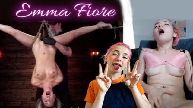 Cute petite reacts to BDSM video and reaches orgasm